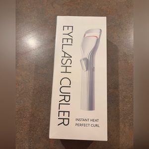 Heated eyelash curler